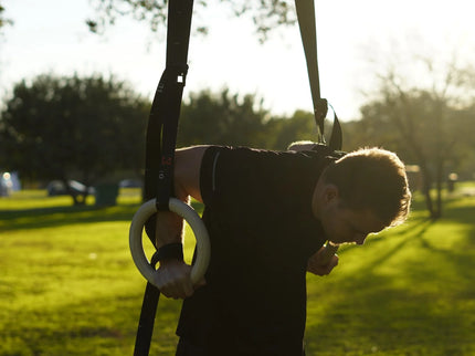 Athlete doing dip on workout rings