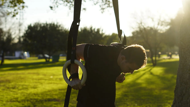 Athlete doing dip on workout rings