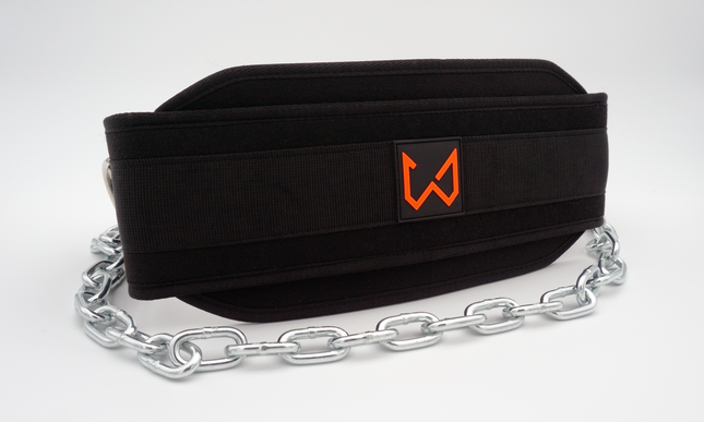 Black nylon dip belt with steel chains displayed coiled, showcasing minimal design and rubber logo patch.