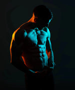 Muscular man with a glowing blue outline against a dark background