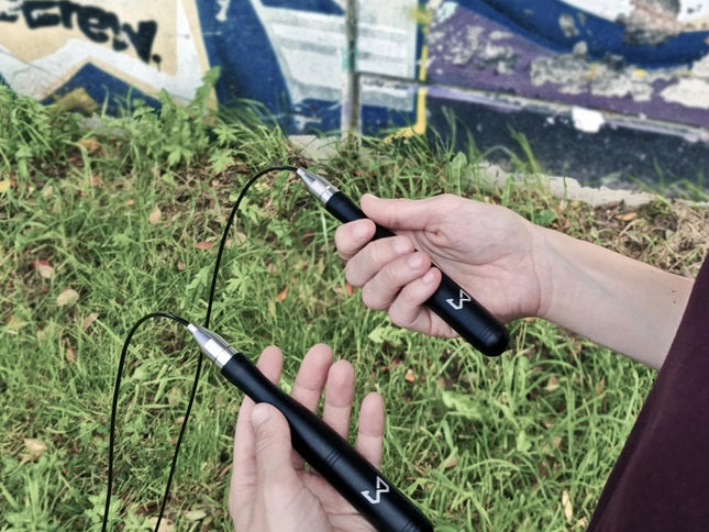 Person holding a jump rope with graffiti in the background