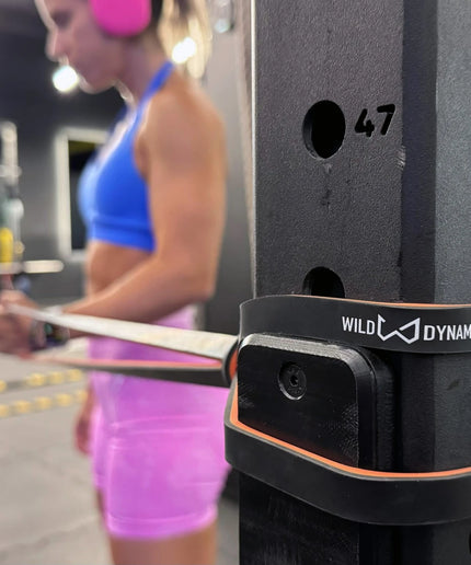 Female athlete exercising with wild dynamics resistance bands
