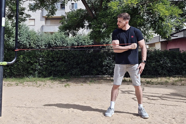 Athlete exercising with resistance bands of wild dynamics outside