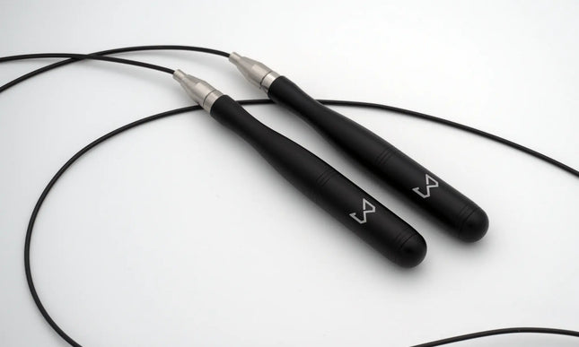 Black jump rope with silver ends on a white background