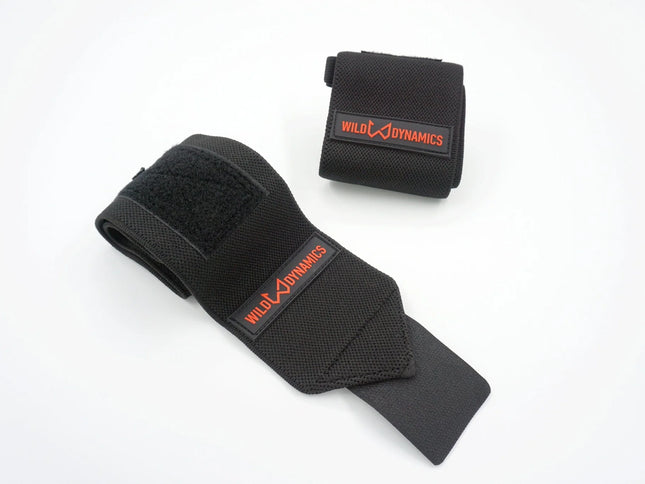 Black wrist wraps with 'Wild Dynamics' branding on a white background