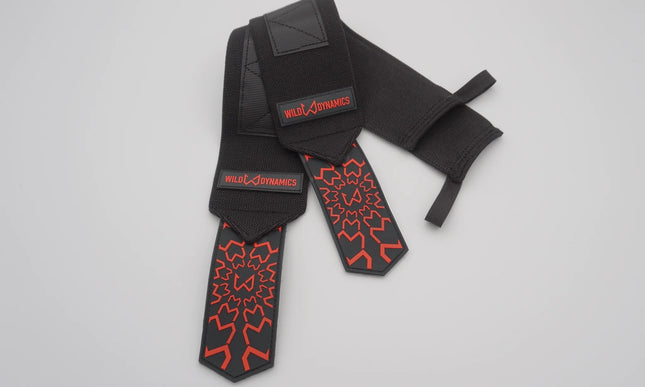 Black and red wrist wraps with 'Wild Dimension' branding on a light gray background