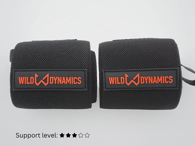Two black wrist wraps with 'Wild Dynamics' logo on a white background
