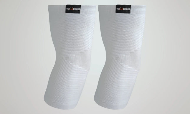 Pair of white elbow sleeves with visible branding on a light gray background