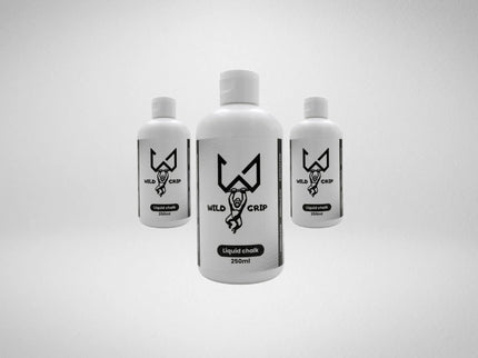 Three bottles of Wild liquid chalk on a light gray background