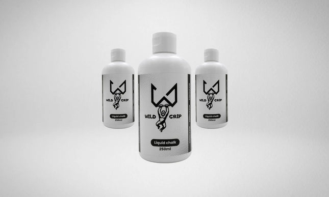 Three bottles of Wild liquid chalk on a light gray background