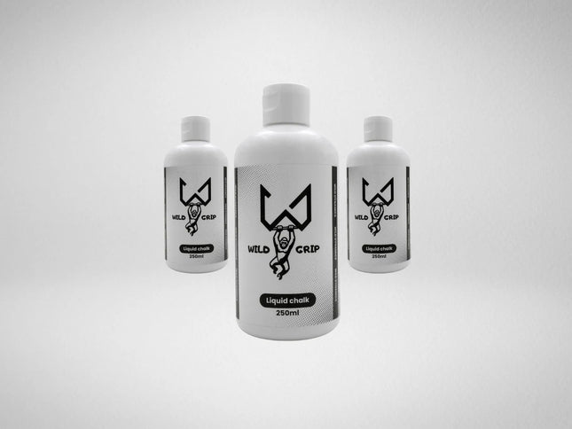 Three bottles of Wild liquid chalk on a light gray background