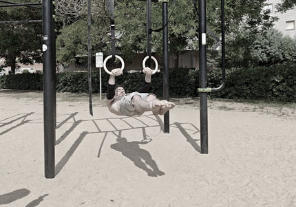 Athlete doing front lever on rings of wild dynamics